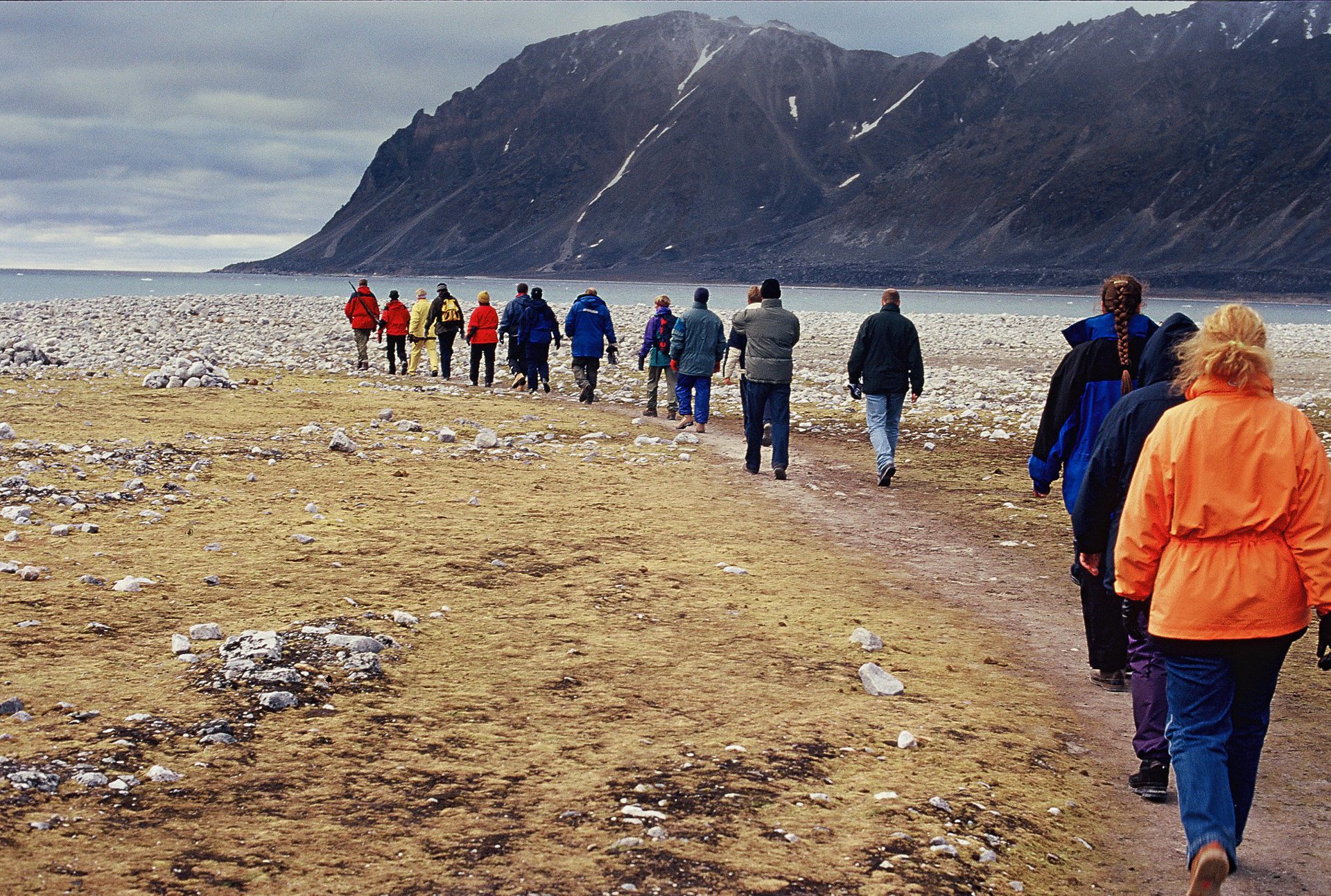 Well-managed tourists in Magdalena Fjord, Spitzbergen Well-managed tourists in Magdalena Fjord, Spitzbergen