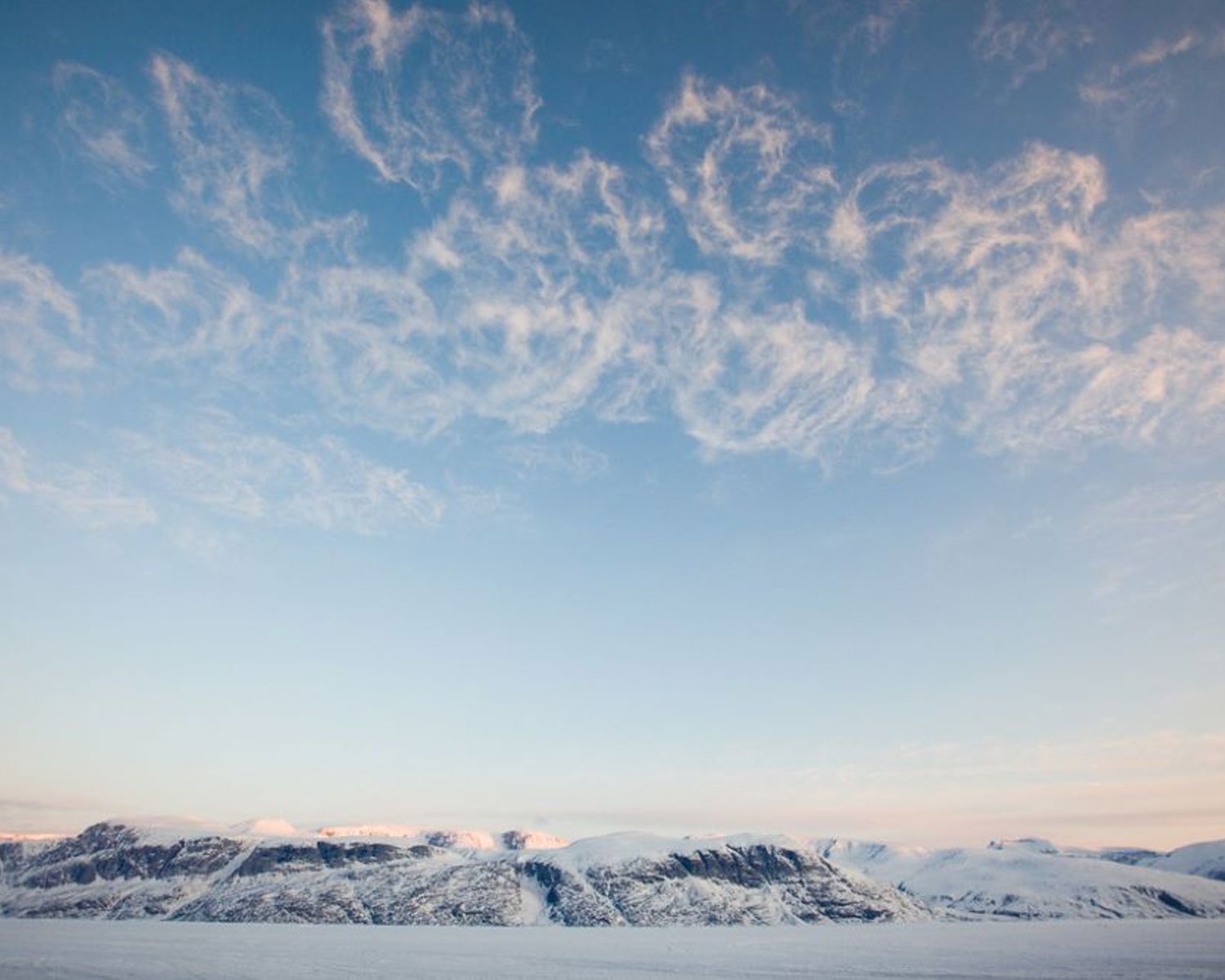 Clouds over peaks in Uummannaq, Greenland